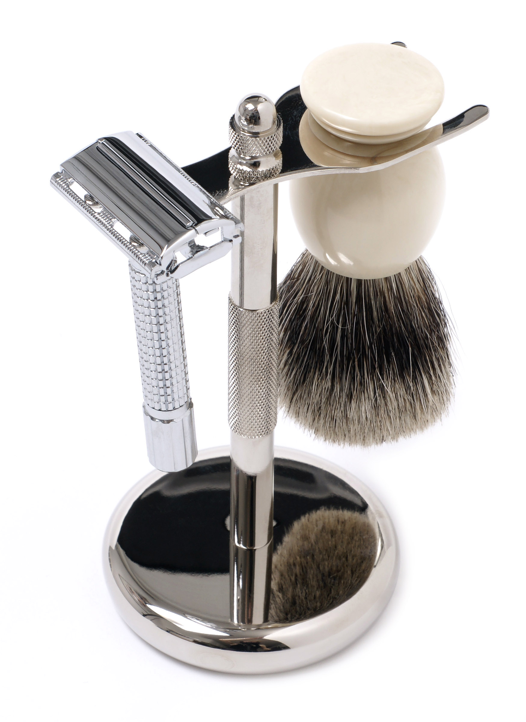 Still-life of a safety razor and badger brush on a chrome stand with soap